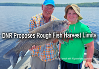 image of Brice Demuth with bigmouth buffalo fish caught on Big Sandy Lake